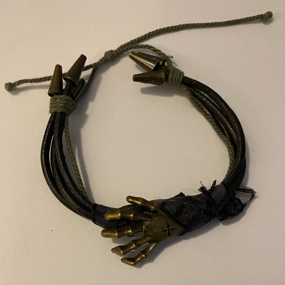 NEW one of a kind handcrafted Brass skeleton hand with drawstring